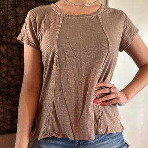 Tan colored short sleeved shirt
